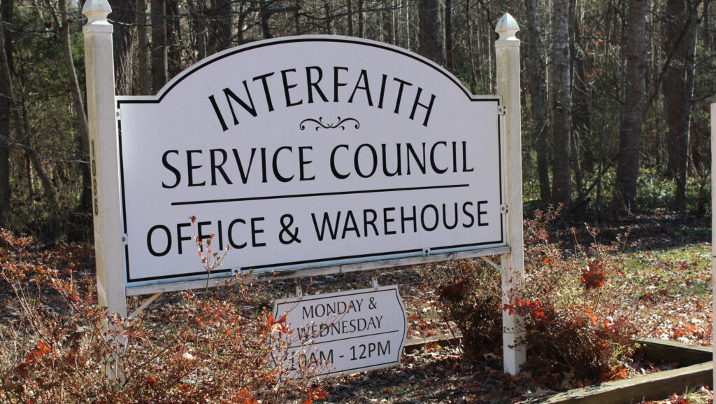 Sign at the Interfaith Service Council Warehouse at 1086 Harris Rd in Kilmarnock, VA. Open Monday and Wednesday from 10 AM - 12 PM